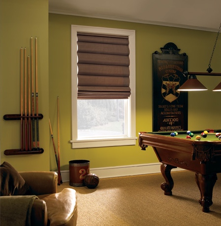 Roman shades in Austin game room with green walls.